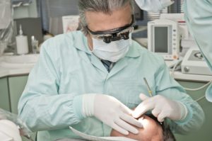 a dentist working on a patient