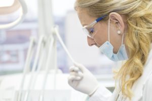 a dentist working tooth extraction