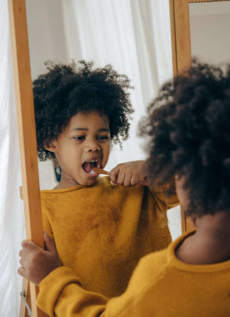 child brushing teeth