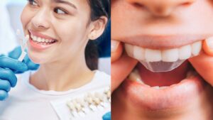 A smiling female patient at the dentist holding a dental mirror.